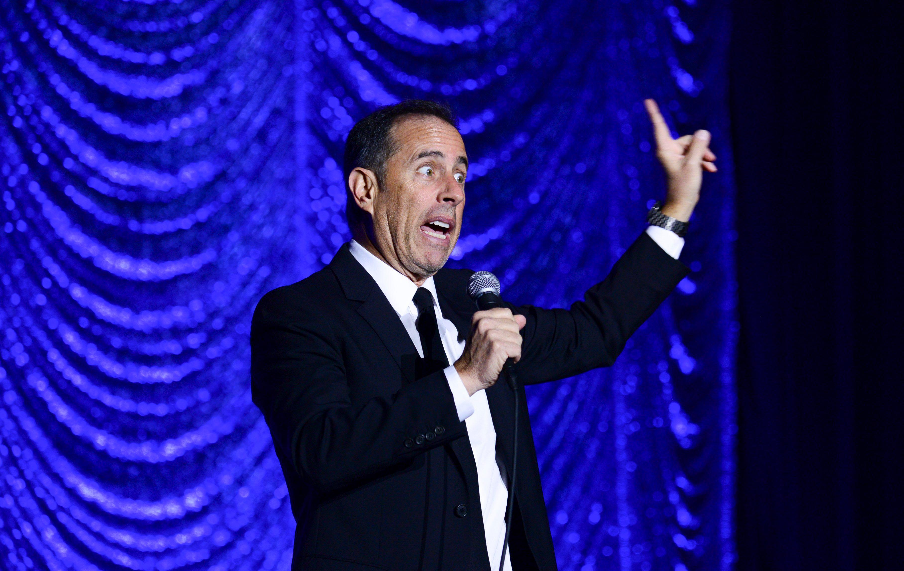 Jerry Seinfeld performing stand-up comedy.