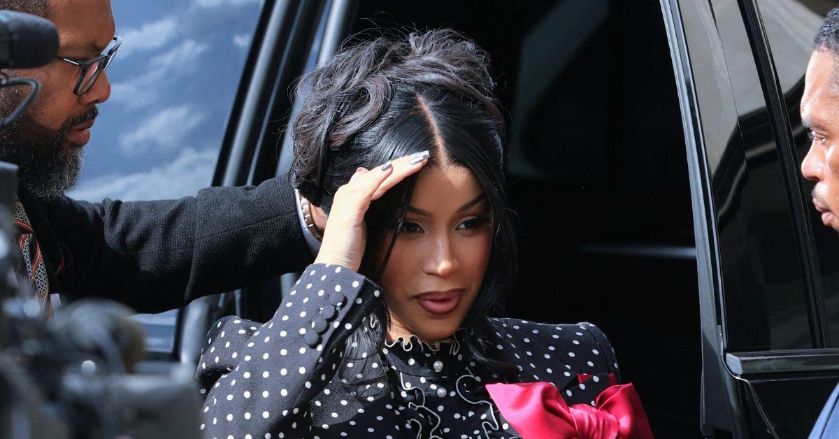 Cardi B dodging reporters on her way into court.