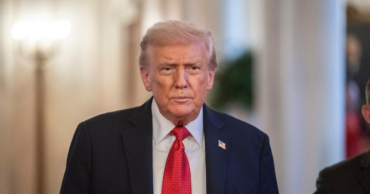 President Donald Trump walking in the White House.
