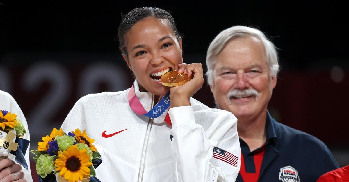 Napheesa Collier of Team United States bites her gold medal.