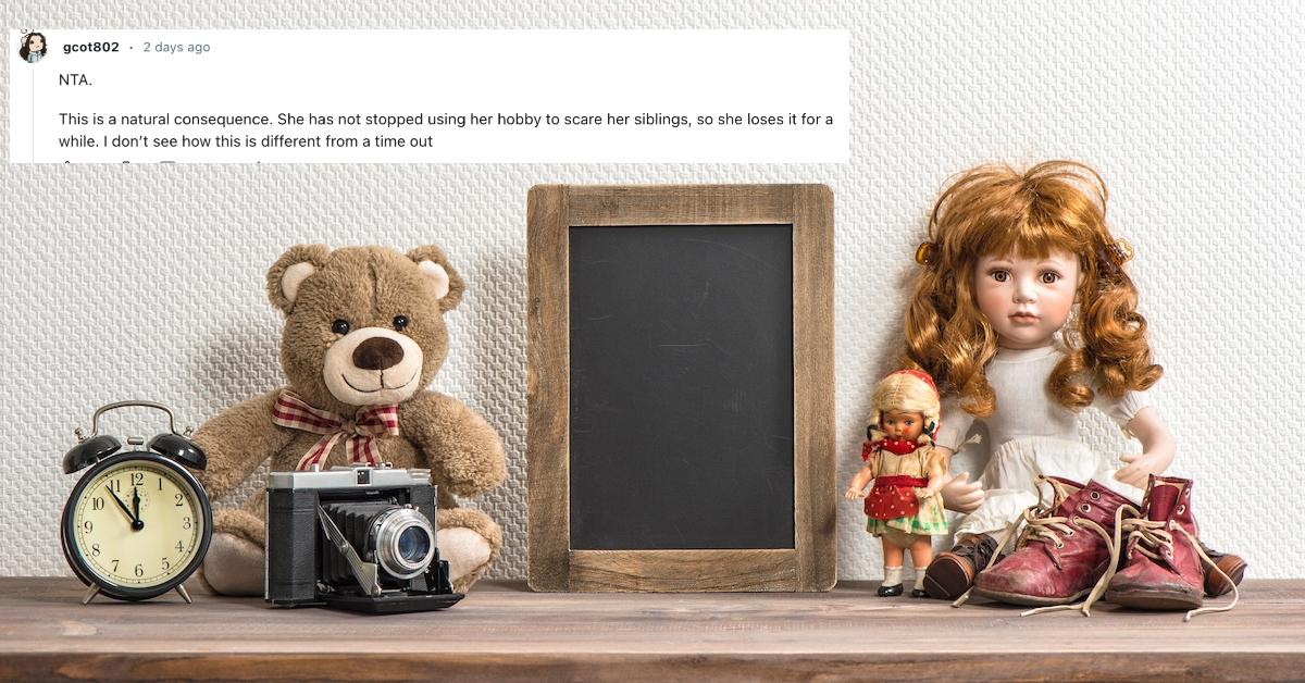 A book shelf with toys, a clock, a camera, a chalk board, and a porcelain doll