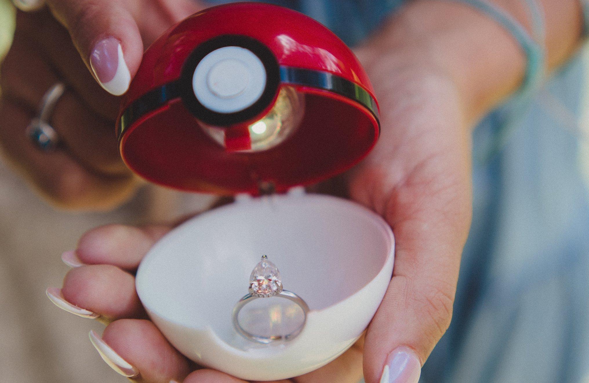Kelsi's engagement ring in a PokéBall