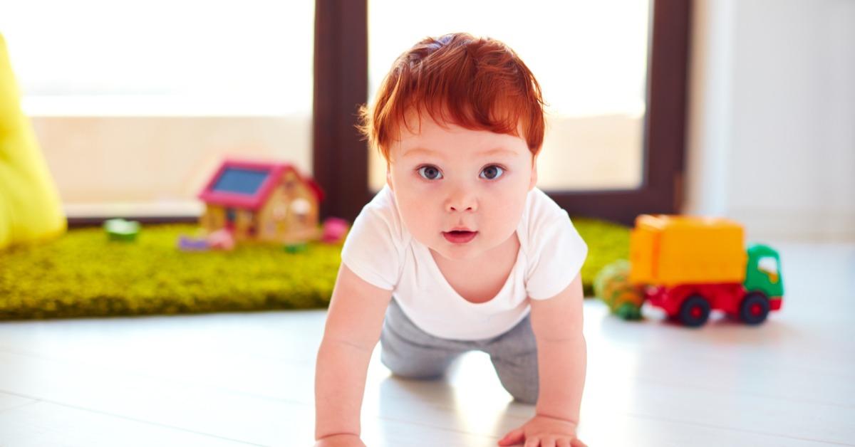 cute toddler baby crawling on the floor at home picture id