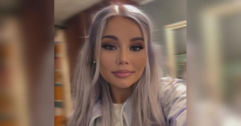 Whitney Purvis shows off her purple hair in a selfie.