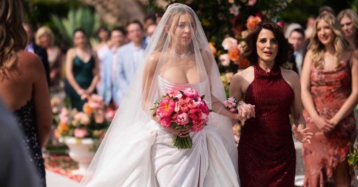 Cassie walking down the aisle with her mom