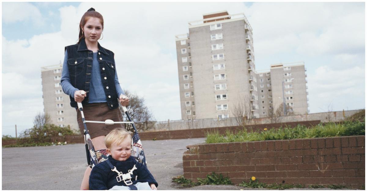 (l-r): A teen mom walking with her baby in a stroller.