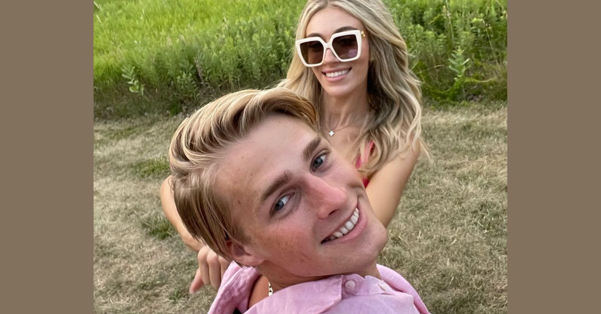 Micah and Victoria pose for a selfie together in a field