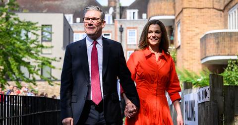 Leader of the Labour Party Keir Starmer walks with his wife Victoria Starmer, as they arrive at a polling station to place their votes in the 2024 General Election on July 04, 2024 in London, England