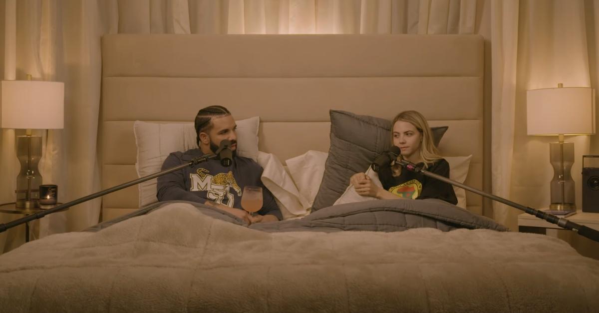 Bobbi Althoff interviews Drake in a large bed with microphones.