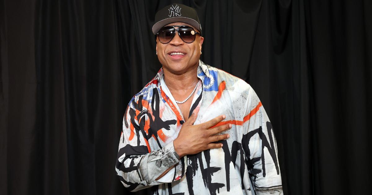 LL Cool J wearing sunglasses with hand over his heart