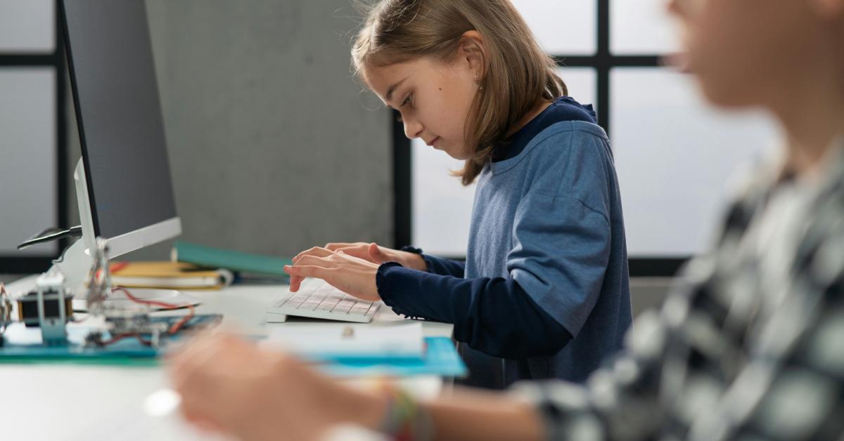 Kids working on a computer.