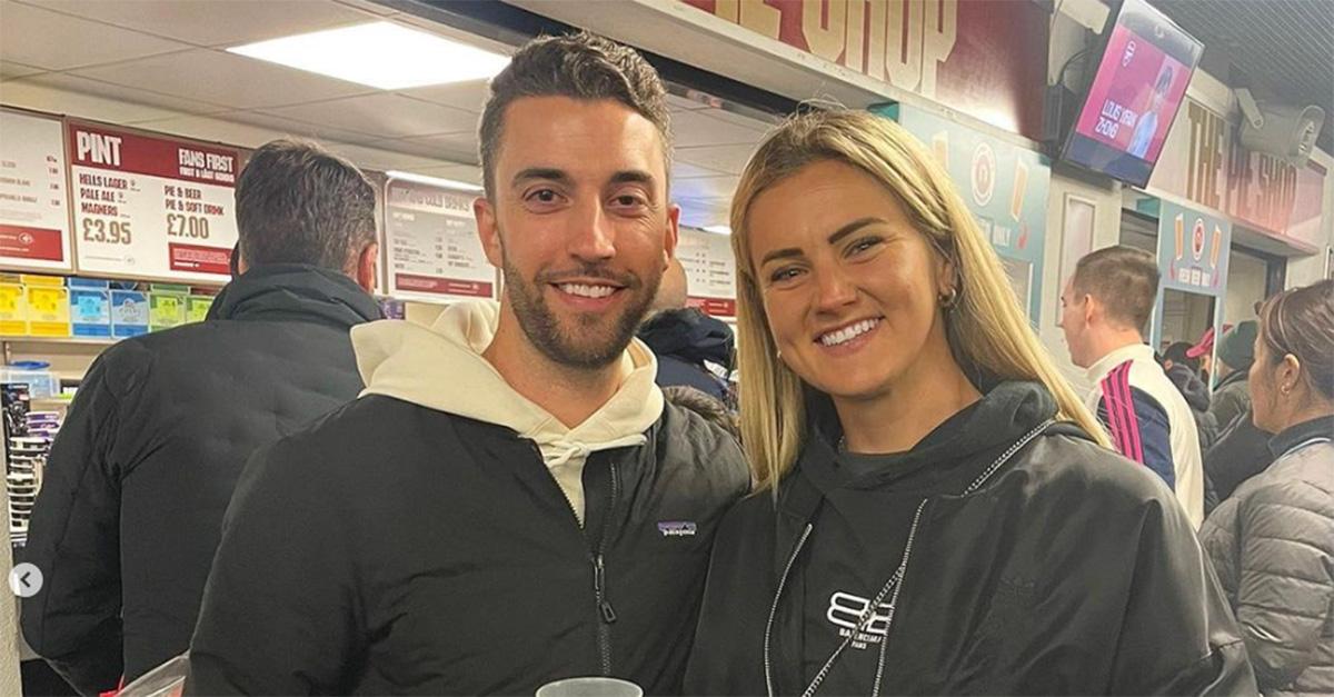 Lindsey Horan and Tyler Heaps in front of the pie shop smiling. 