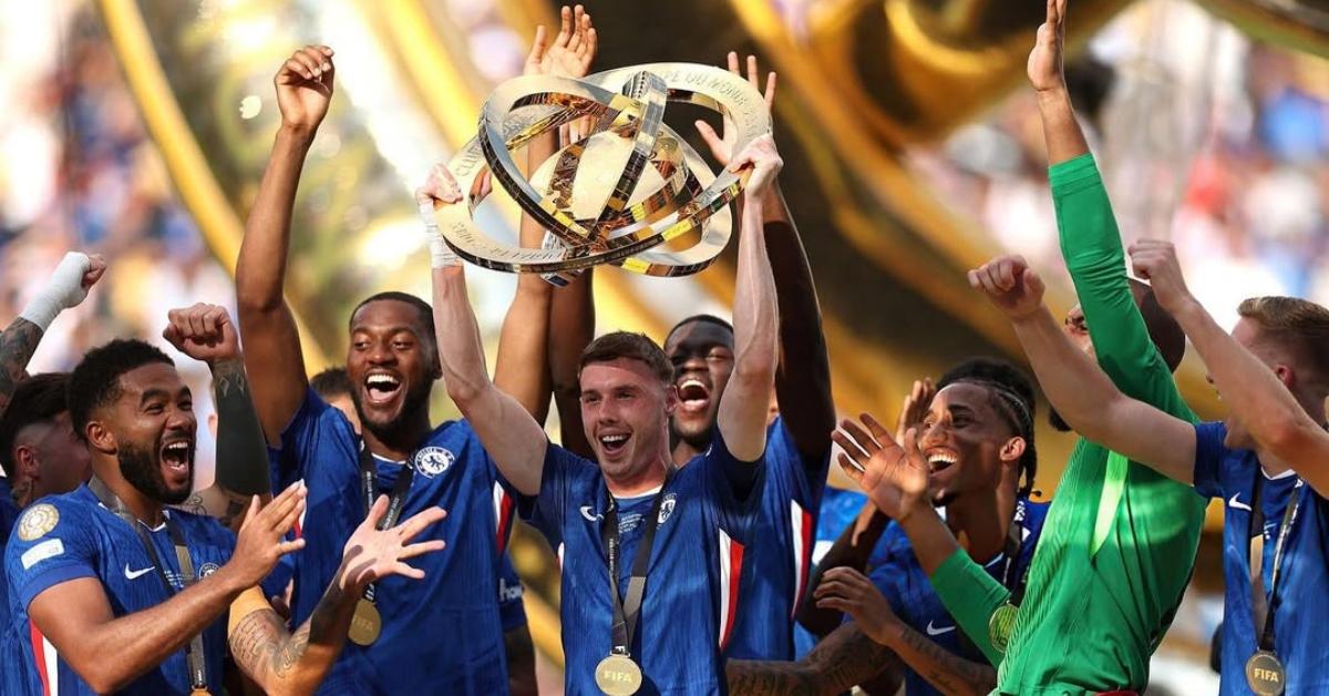 Cole Palmer holding up the World Cup trophy