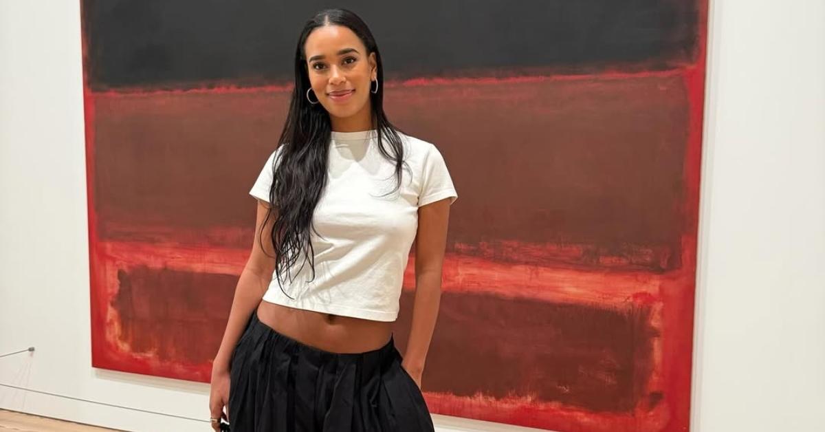 Mia from Summer House in front of a painting at a museum.