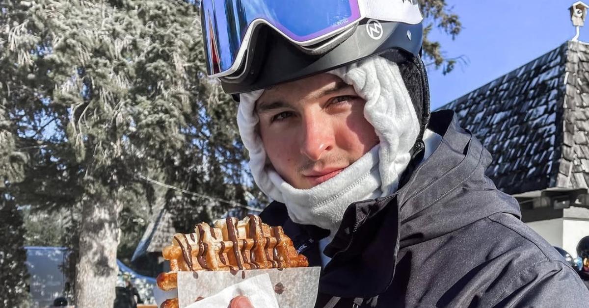 Michael Stickler in a snowsuit with a waffle.