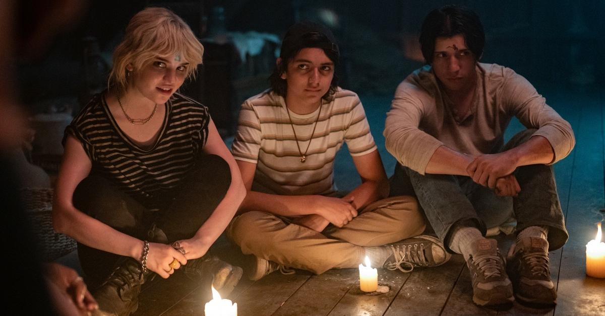 Natalie (Sophie Thatcher), Javi (Luciano Leroux), and Travis (Kevin Alves) attend a séance in Season 1.