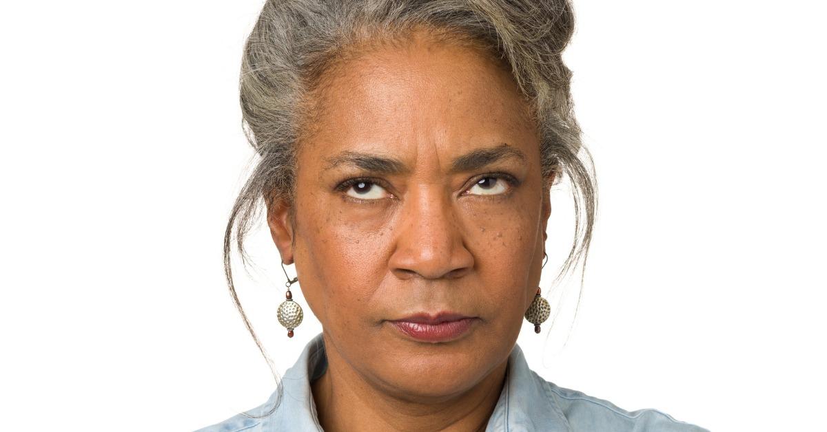 mature woman looks upwards picture id