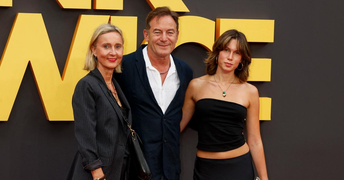 Emma Hewitt (L) and Jason Isaacs (center) with their youngest daughter, Ruby Isaacs (R)