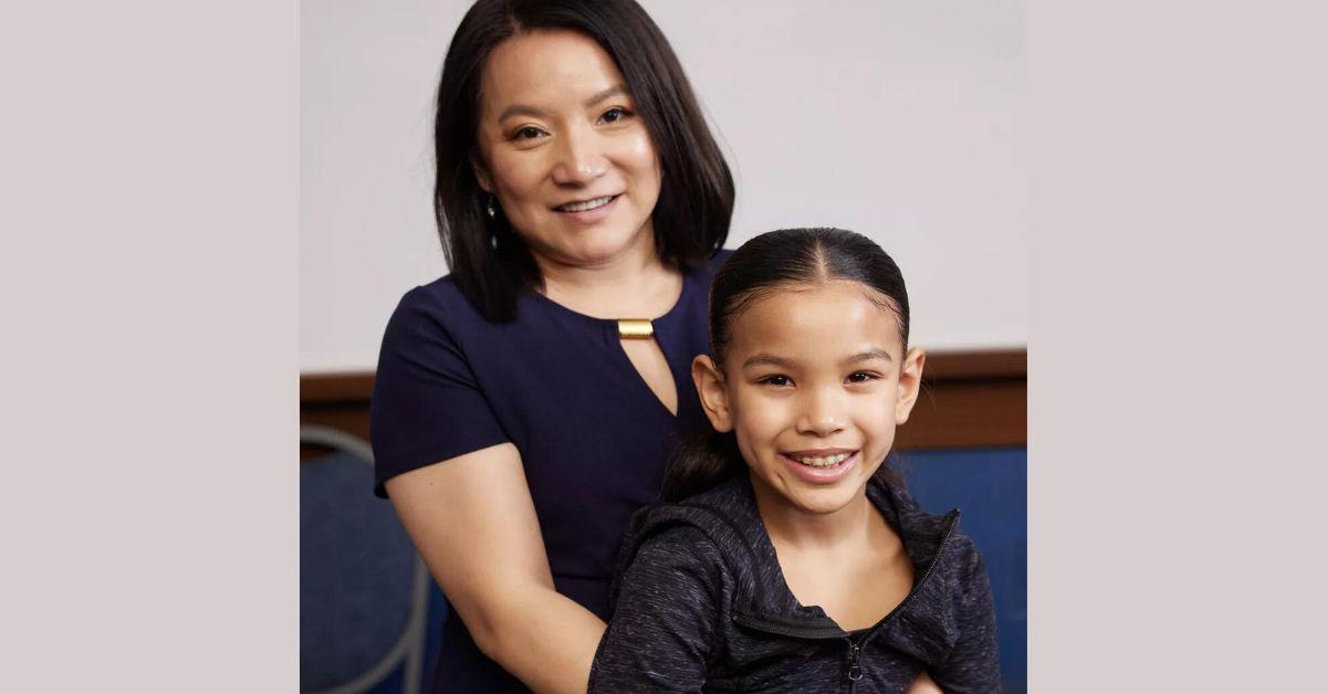 Min poses for photo with Mina seated on her lap for 'Dance Moms: A New Era' promo photo