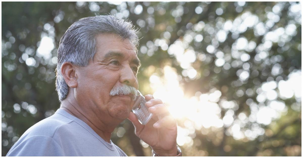 An older man talking on the phone