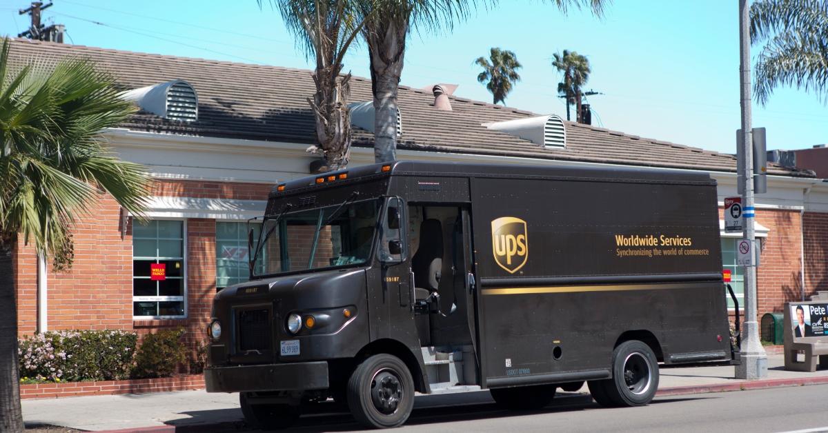 UPS truck parked outside a wells fargo on hot sunny day