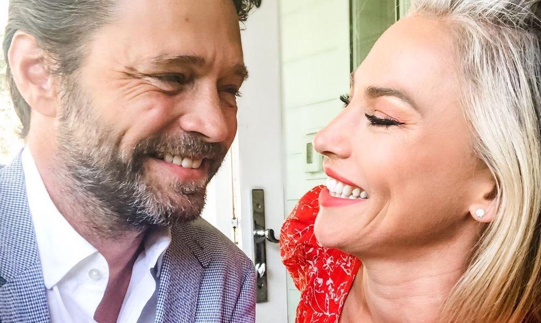 Jason Priestley and Naomi Lowde-Priestley smiling