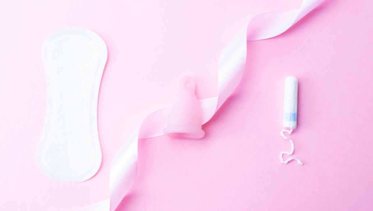 Menstrual pads, menstruation cup and tampon for woman hygiene on pink background. Menstruation feminine period. 