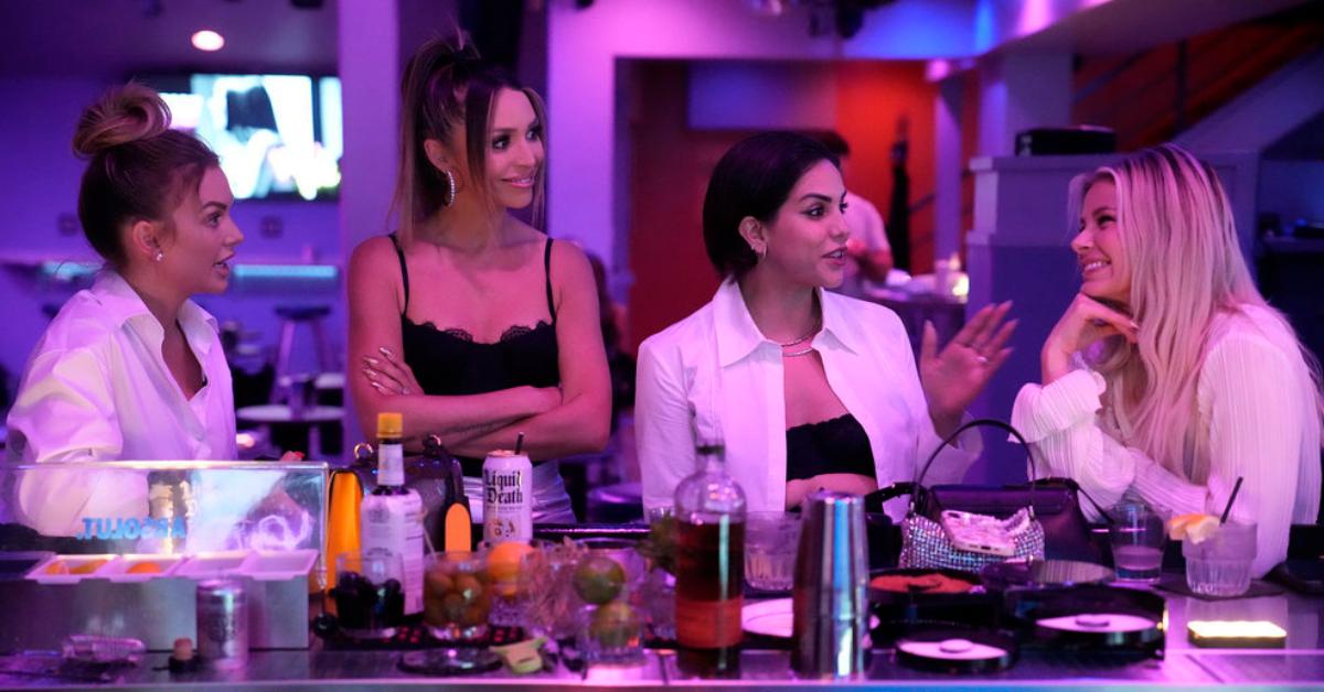 (L-R) Lala Kent, Scheana Shay, Katie Maloney, and Ariana Madix talk at a bar during 'Vanderpump Rules.'