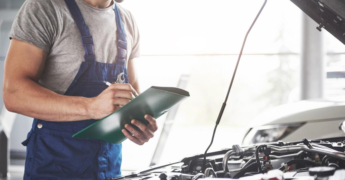 portrait of a mechanic at work in his garage car service repair and picture id