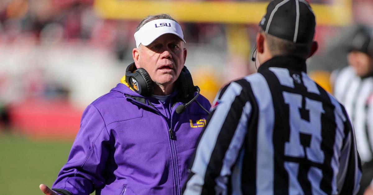 Brian Kelly with a ref during NCAA Football 2022 game.