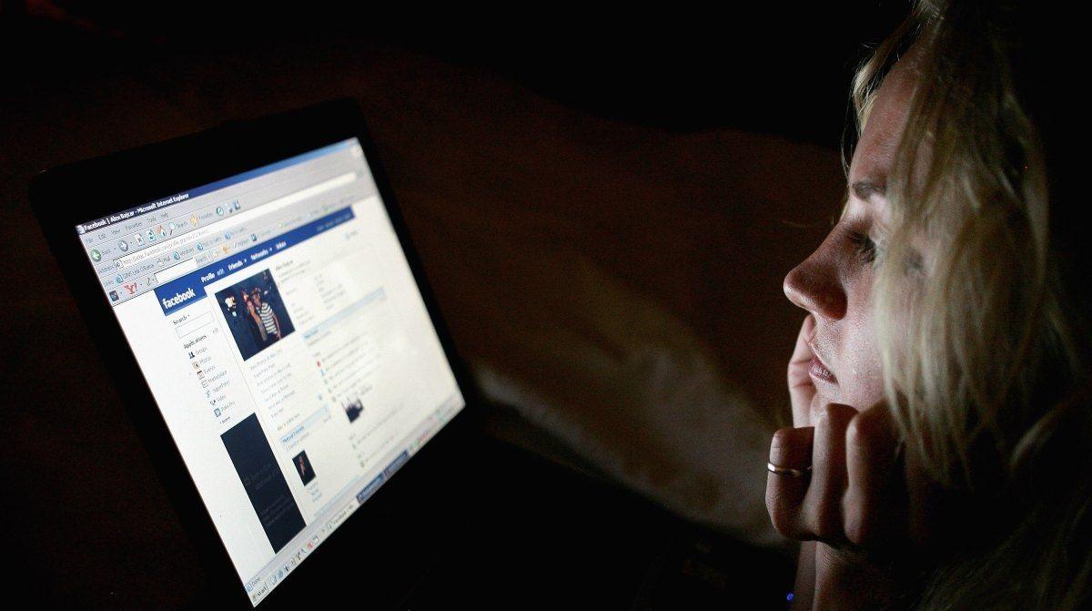 Woman looking at Facebook