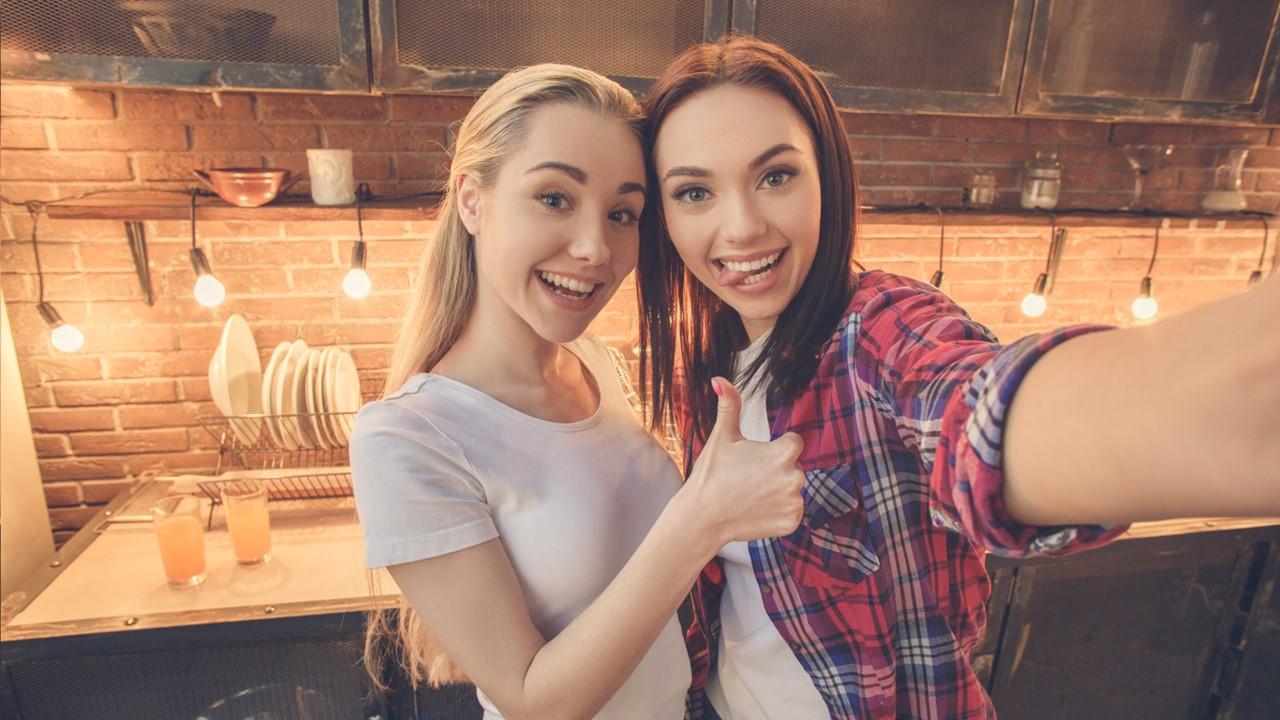 Two women taking a selfie in a kitchen