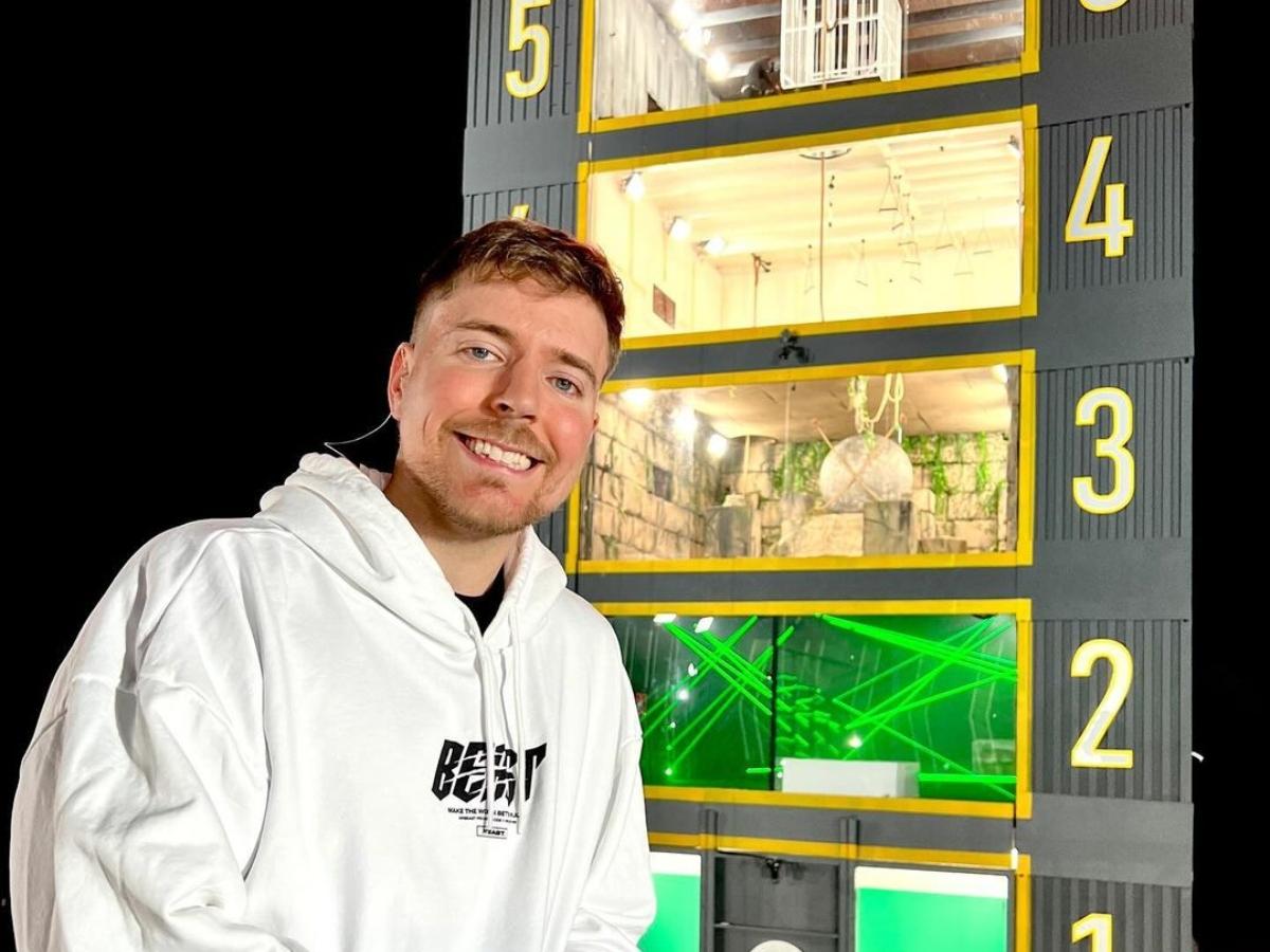 MrBeast in front of a tower for one of his YouTube competitions