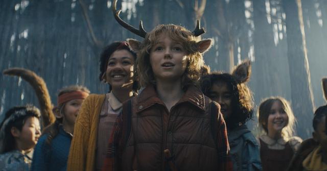 (C) Christian Convery as Gus surrounded by some of the cast of 'Sweet Tooth' in a scene from 'Sweet Tooth' Season 2