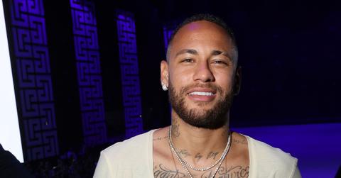 Neymar posing at a Fashion Week party
