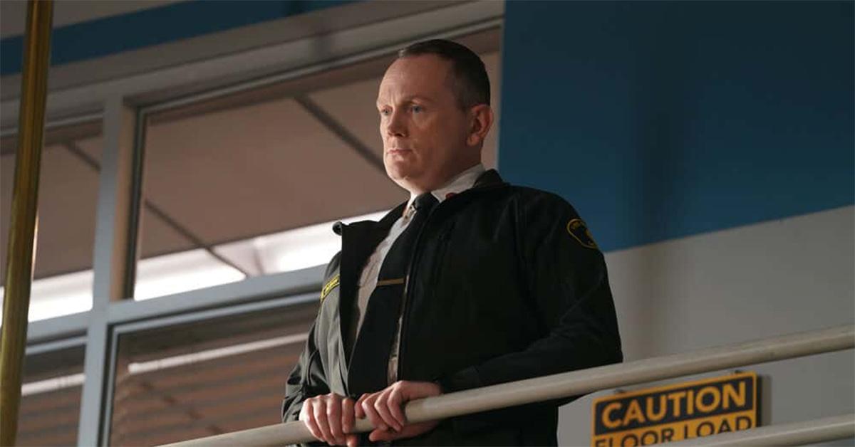 Michael Dixon standing over a fire station on 'Station 19.' 