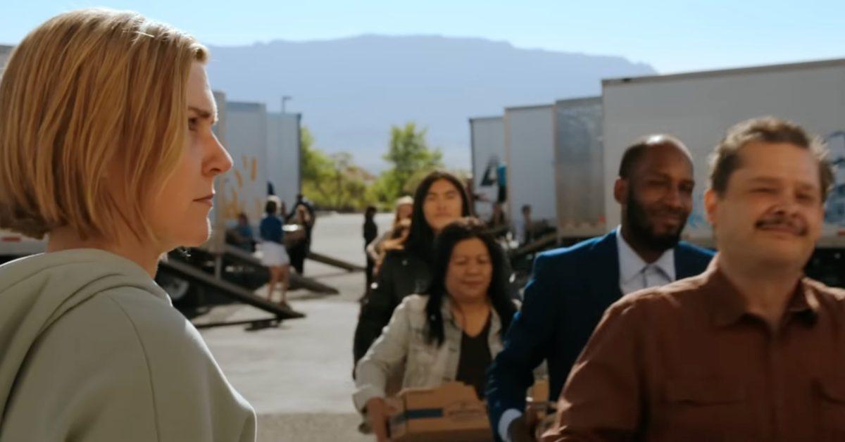 A scene from 'Pluribus' with people smiling.