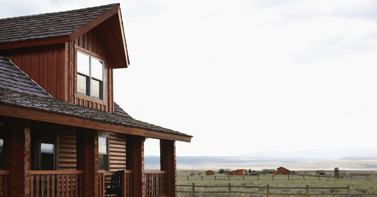 Home on land in Montana with mountainous backdrop