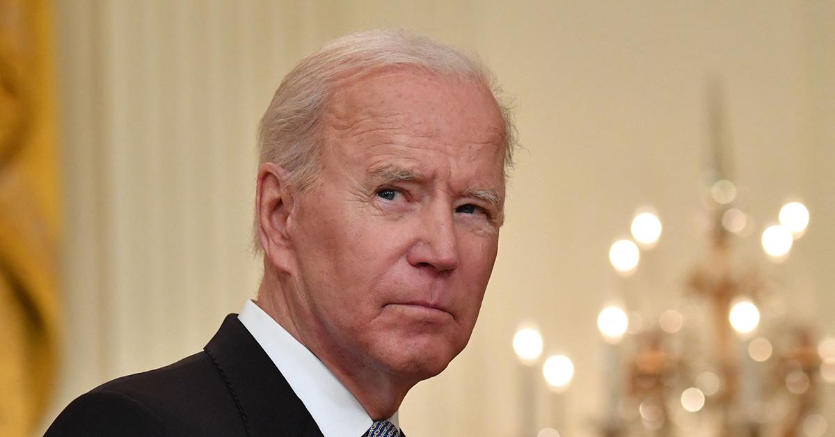 Joe Biden looking to the right in the White House. 