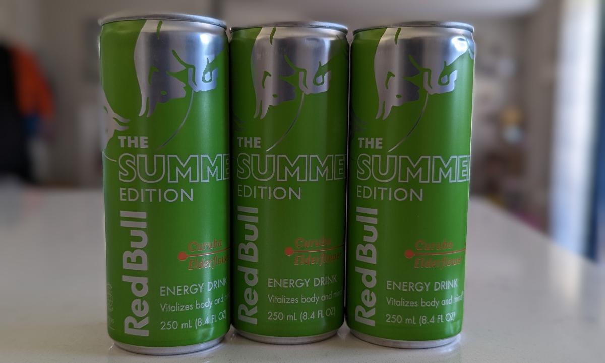 Three cans of Red Bull Summer Edition Curuba Elderflower on a kitchen counter