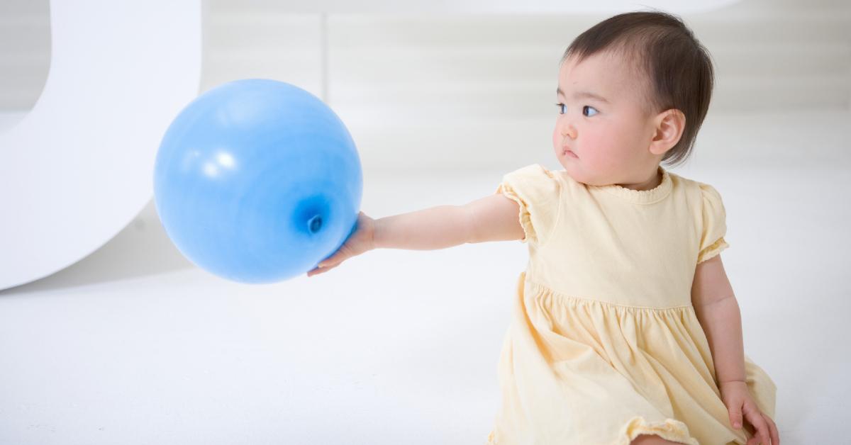 Baby Holding Balloon