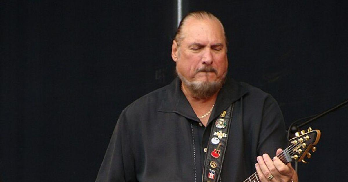 Steve Cropper playing guitar on stage. 