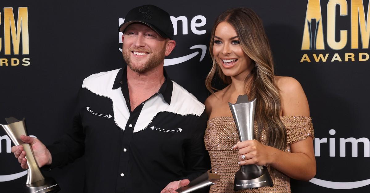 Cole Swindell and Courtney Little posing with his awards at the 58th Academy of Country Music Awards in Frisco, TX