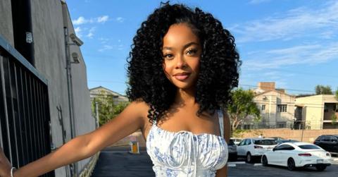 Skai Jackson wearing a blue and white dress.