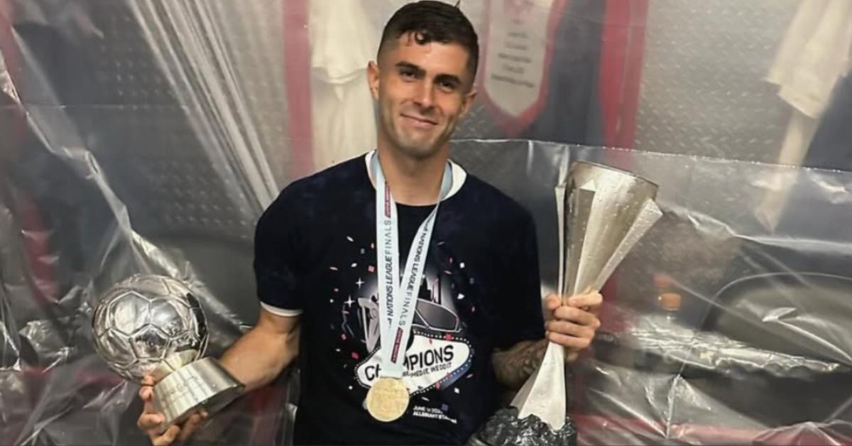 Christian Pulisic poses with his trophies in 2023.