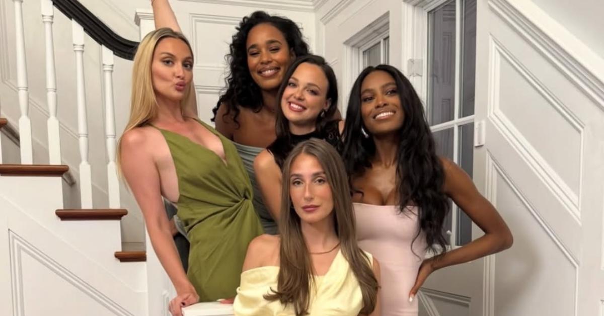 Amanda, Ciara, and the other ladies from Summer House pose on stairs.