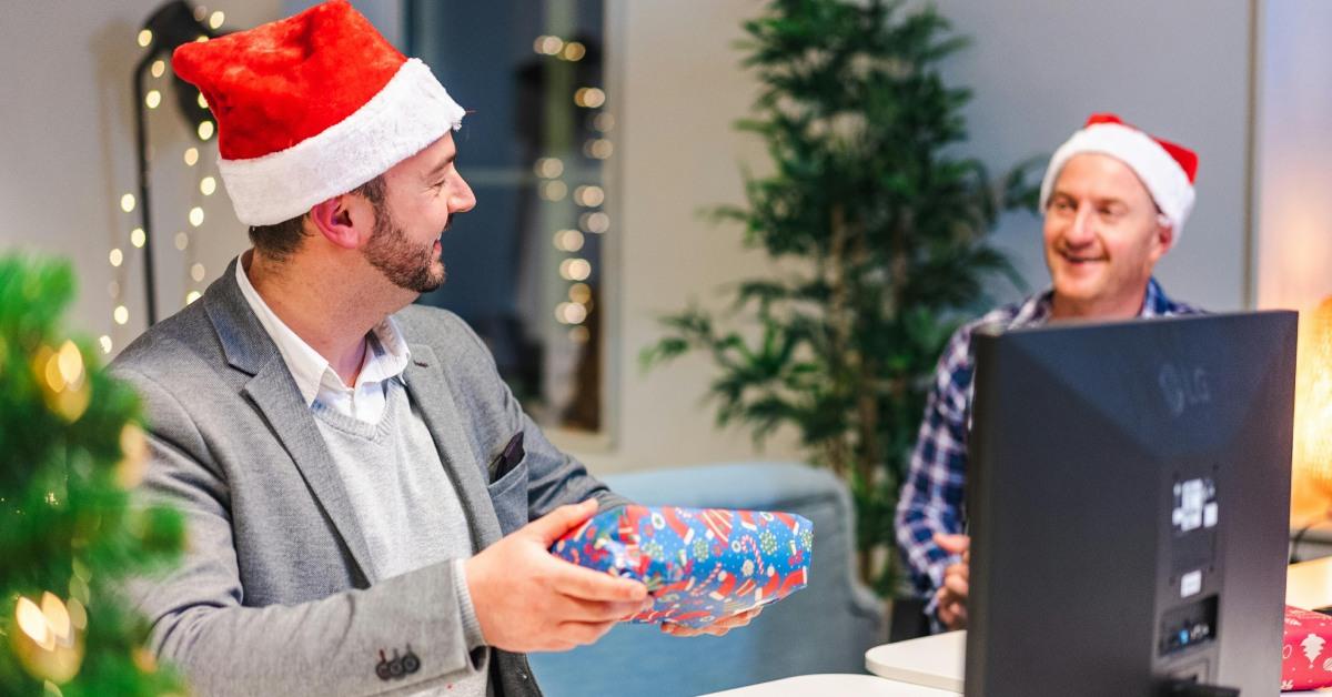 Co-workers exchanging Christmas gifts.