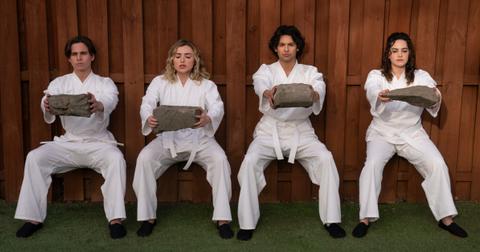 (L-R) Tanner Buchanan as Robby, Peyton List as Tory, Xolo Maridueña as Miguel, and Mary Mouser as Sam in Season 6 of 'Cobra Kai.'