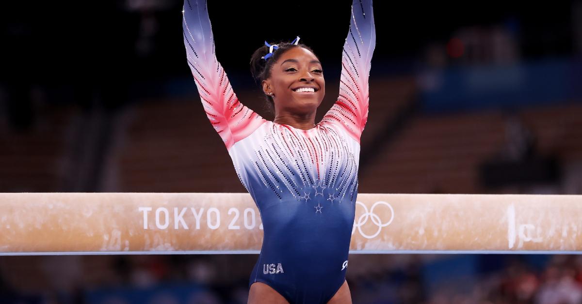 Simone Biles smiles after competing in the Women's Balance Beam Final at the Tokyo 2020 Olympics on August 3, 2021.