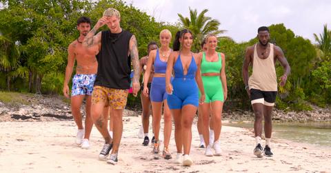 (L-R): Justin Assada, Stevan Ditter, Elys Hutchinson, Alara Taneri, Micah Lussier, and Kaz Bishop arrive to the beach for a compatibility challenge in Season 2, Episode 6 of 'Perfect Match.'